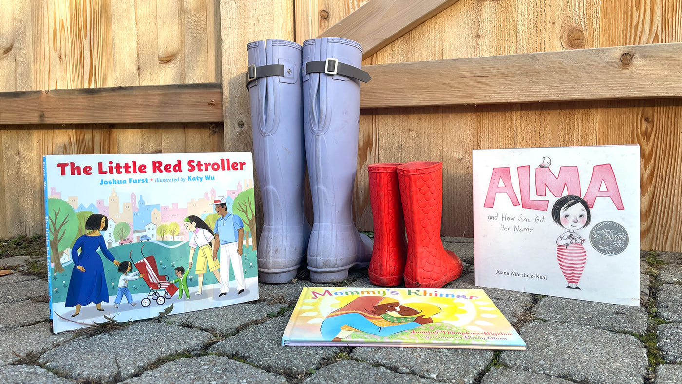 3 diverse kids books from our subscription box displayed outside