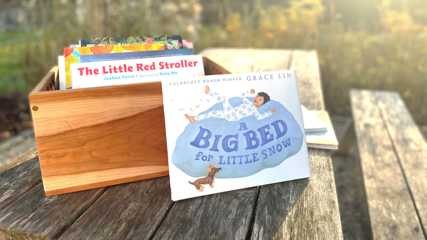 Diverse Kids Books displayed on a picnic table