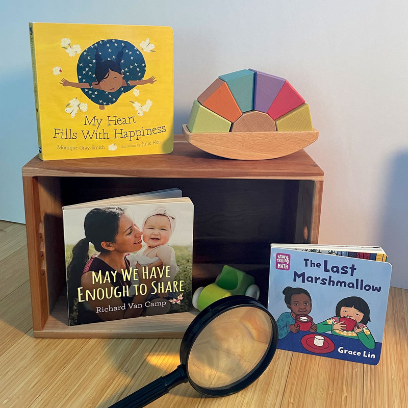 Three Diverse Books For Infants on a Shelf